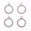 Close-up of four silver circular rhinestone pendants for DIY jewelry making and crafts - Silver Circle