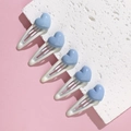 Close-up of five white metal BB hair clips featuring blue 3D heart shapes for girls - Blue