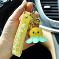 Cute glowing octopus resin keychain in yellow and mint green with Sweet Honey hand strap - Yellow