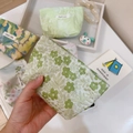 Detail of floral canvas pouches with simple wish labels and zipper closure textures - Light Green Small Floral