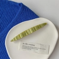 Macro detail of wave-textured light green resin hair clip with France Handmade engraving - Oval Clip / Grass Green