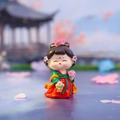 Traditional Chinese girl tumbler doll in red and green Hanfu holding flower basket - Walking Among Flowers Large