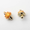 Detailed close-up of two mini orange enamel mushroom pendants with golden alloy accents - Mushroom Shape / Yellow Mushroom