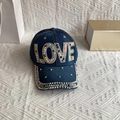 Detail of blue denim baseball cap featuring colorful rhinestone LOVE lettering and brim - Adult, Adjustable / Denim Blue AB Rhinestone LOVE