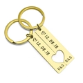 Macro shot of custom engraved gold rectangle keychains with a heart puzzle cutout - Gold (1 Pair)