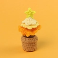 Handmade crochet Christmas tree in yellow gradient with a star on a warm orange background - Gradient Yellow - Christmas Tree Potted Plant (Mini Woolen Pot)