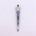 Detail of beaded pen with black and white gradient body and gray silicone daisy top - Grey Flower