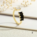 Detailed close-up of a gold open ring featuring white and black rectangular crystals - Adjustable Open / Black And White Stone Style (RG0628-F)