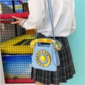 Sky blue vintage telephone crossbody bag with gold dial shown on a JK uniform outfit - Sky Blue
