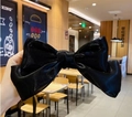 Oversized black satin bow hair clip with a stylish textured finish for women - Black Iridescent Bow Clip