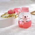 Pink liquid glitter keychain featuring a miniature tiger in a bottle-shaped charm - Pink Soda Bottle