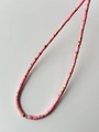 Handmade pink natural stone beaded necklace with gold metal spacers and marble accents - Pink Turquoise