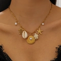 Dettaglio di ciondoli marini placcati oro 18K con stella marina, tartaruga e conchiglie - Stile Mare Vacanze Estive (12) / Oro
