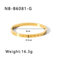 Detail showing gold starburst engraving and cubic zirconia stones on titanium steel bangle - Gold Starburst Style (NB-B6081-G) / 18K Gold