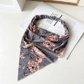 Detailed flat lay of floral print triangle headscarf in grey with pink blossoms - Grey Floral