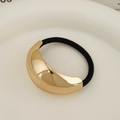 Minimalist black elastic hair tie featuring a large polished golden crescent metal detail - Large Oval KC Gold