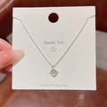 Detail showing a silver heart pendant with translucent gemstone on a display card - Silver (Moonstone Round)