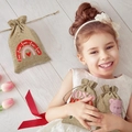 Close-up of linen drawstring gift bags with heart and love prints in a cozy setting - 10*14cm / Rainbow Style