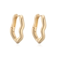 Macro detail of irregular gold metal hoop earrings with wavy texture and mirror finish - Gold Wave Shape