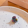 Mini marble resin hair claw clip with Original Handmade text in a ceramic dish - Fiery Multicolor