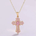 Macro shot of gold cross necklace with pink zircon oval stone and pavé crystal detail - Necklace / Gold Pink Zirconia