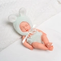 Sleeping 20cm reborn baby doll in light green plush rabbit jumpsuit on white blanket - Green White Rabbit Plush