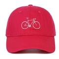 Detailed close-up of a red cotton baseball cap with white embroidered bicycle logo - Rose Red