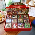Christmas tin box set with snowman and Santa patterns on a rustic wooden table surface - Christmas Square Tin Boxes (Pack of 12)