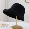 Women's black checkered bucket hat with wide brim on a minimalist gold display stand - Minimalist Textured Style / 12136 Navy Blue
