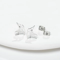 Minimalist hollow bird stud earrings in stainless steel on white tray display - Steel