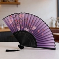Elegant purple gradient folding fan with cherry blossom pattern and black tassel detail - Style 52 (New Style)