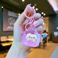 Dettaglio portachiavi a forma di pecora rosa con olio liquido, campanello e ciondolo stella - Stile Chiusura a Moschettone / Stile Rosa di Perle a Bolla Noctilucente