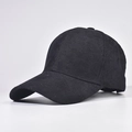 Close-up of the black corduroy fabric texture and curved brim on a baseball cap - Adjustable / Black