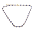Détail d'un collier en plaqué or avec plusieurs pendentifs œil bleu en émail brillant - Collier Bleu