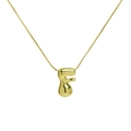Detailed close-up of 18K gold-plated bubble letter F pendant on a delicate chain - Gold F