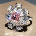 Elegant floral cluster ring featuring a square pink gemstone and clear teardrop petals - US 6 / Pink