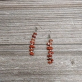 Detail of bohemian drop earrings with red natural crystal beads and silver spacers - Silver - Red Agate
