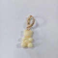 Chic gold huggie earring with sparkling cubic zirconia and creamy resin gummy bear pendant - Cream White