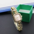 Close-up of a gold square watch with crystal rhinestones and a floral-shaped metal strap - Square Gold Pink