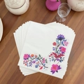 Floral printed paper napkins with purple and pink flower patterns on wooden tabletop - Purple Wildflowers