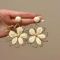 Macro shot of large raffia woven flower earrings with gold bead center and metal trim - Gold-White (8# Silver Pin)