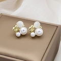 Elegant geometric pearl stud earrings with gold finish and cat-eye stone on a silk display - E2820-2 Gold Triple Bead Cat Eye