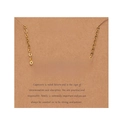 Detailed view of Capricorn zodiac necklace in 18k gold plating on brown card - Gold-Capricorn