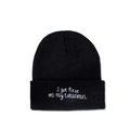 Detail view of black beanie with white 'I got here on my unicorn' slogan embroidery - M (56-58cm) / Black Embroidery Style