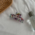 Detail of a medium acetate hair claw with colorful abstract ink patterns and polished finish - Medium Square Claw / Multicolor