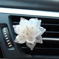 Car vent clip air freshener featuring a white rhinestone lotus flower design - White