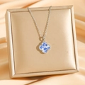 Silver four-leaf clover necklace with blue porcelain pattern on luxury jewelry box - Silver
