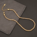 Minimalist geometric Cuban chain necklace in gold and silver tones on a slate background - Gold and Silver Bi-color Twisted Chain with Beads (2#)