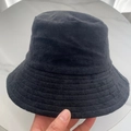 Close-up of the black terry cloth bucket hat showing its soft fuzzy texture and thick fabric - M (56-58cm) / Black