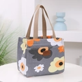 Sac isotherme gris avec motifs floraux orange et poignées marron résistantes - Floral Gris